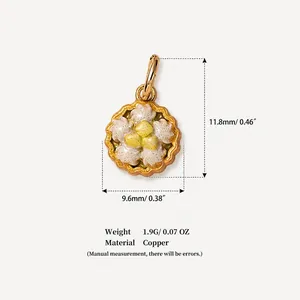 Macro detail view of a copper cake-shaped pendant with precise size and weight specifications