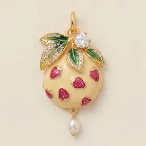 Detailed view of enamel strawberry fruit pendant with pearl and sparkling crystal leaves