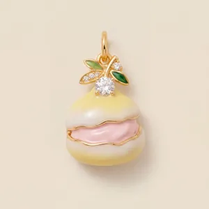 Detail of macaron pendant with pink cream, green leaves and clear cubic zirconia