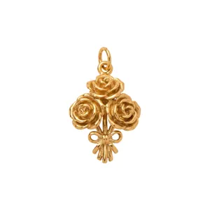 Detailed macro view of an 18K gold plated stainless steel rose bouquet pendant charm
