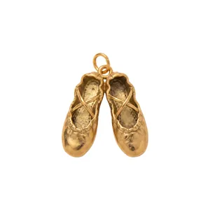 Detailed view of vintage gold ballet slipper charm in 18K gold-plated stainless steel.