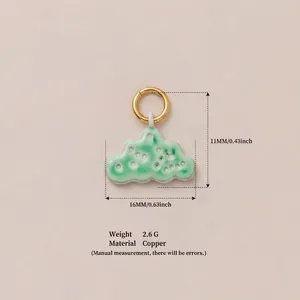 Detail view showing dimensions of a green patterned cloud pendant made of copper.