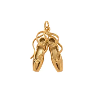 Detailed macro view of a gold-plated ballet pointe shoe pendant crafted in durable stainless steel