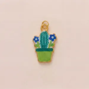 Detailed macro view of a colorful enamel cactus potted plant pendant in titanium steel