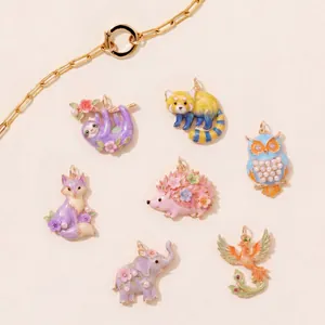 Detailed macro view of colorful enamel animal pendants including owl and elephant styles