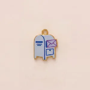 Detailed view of a mailbox pendant with a purple envelope charm in gold-plated steel.