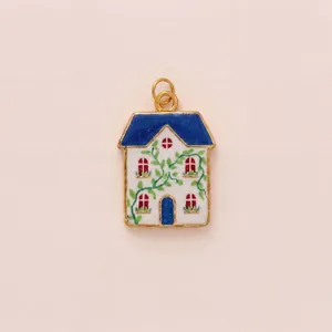 Detail view of a charming garden-style house pendant with colorful enamel work