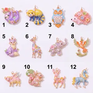 Detailed view of 12 colorful enamel animal charms with pearls for DIY jewelry making