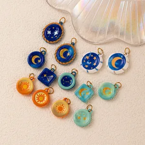 Detailed view of colorful celestial stainless steel pendants with sun and moon designs