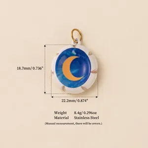 Close-up of a crescent moon pendant made of stainless steel with weight and dimensions.