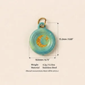 Detailed view of a turquoise moon and star stainless steel pendant with dimension specs
