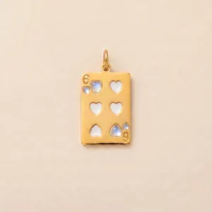 Detailed view of gold 18K plated stainless steel heart six playing card pendant jewelry