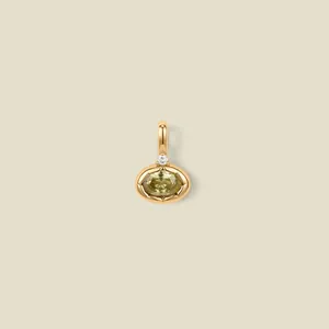 Close-up of an 18K gold plated stainless steel pendant with a green oval gemstone