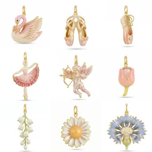 Collection of pink enamel ballet and floral pendants in copper gold finish