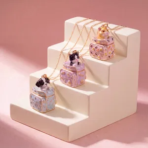 Detailed view of three cute animal suitcase pendants featuring a dog cat and hamster