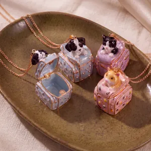 Macro view of cute 3D animal suitcase necklaces featuring puppy and kitten pendants