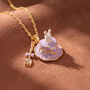Detailed macro shot of a miniature purple heart cake necklace with a cute rabbit