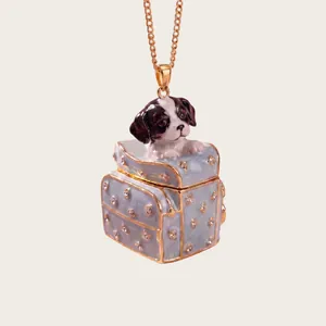 Detailed close-up of a cute dog peeking out from a miniature blue suitcase pendant