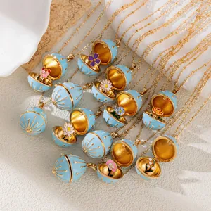 Light blue enamel egg locket necklace with birth flower design, gold plated finish