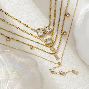 Elegant layered gold necklace set with zircon pendants and stylish paperclip chains