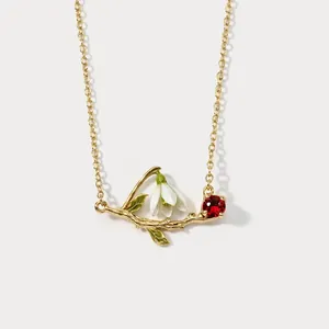Retro gold necklace with lily of the valley pendant and red crystal