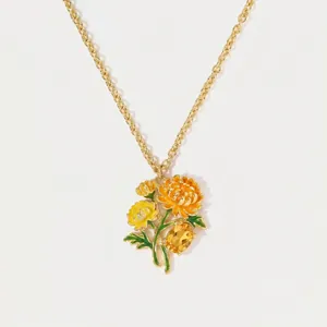 Detail of enamel flower necklace pendant with yellow faceted gemstone detail
