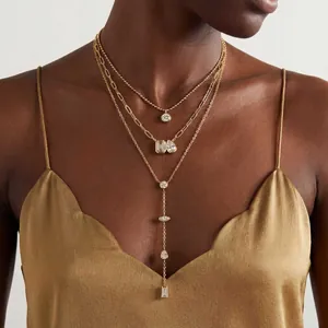 Elegant layered gold Y-shape necklace set featuring multi-shape emerald cut zircons