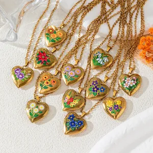 Various vintage gold heart locket pendants with colorful floral month illustrations.