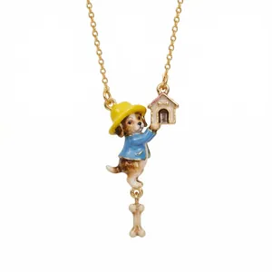 Close-up detail of fairy tale style enamel necklace featuring cute dog, doghouse and bone charms