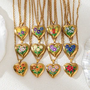 Detail of 12 birth flower heart locket necklaces with colorful enamel designs