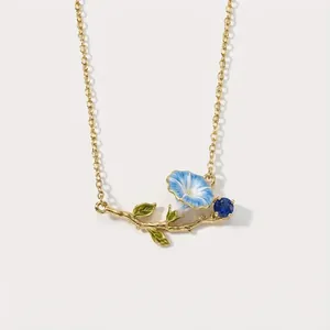 Vintage blue morning glory enamel necklace with gold chain and blue sapphire accents