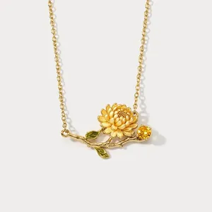 Vintage gold floral pendant necklace with green enamel leaves and yellow sparkling crystal