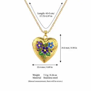 Detail view of golden heart locket necklace with floral enamel and size dimensions