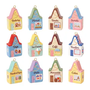 Set de 12 coloridos dijes de casa de acero inoxidable chapados en oro de 18K