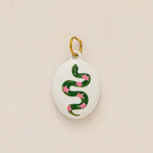 Unique stainless steel oval charm pendant featuring a green snake with pink stars design