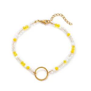 Bracelet de perles fait main avec cristaux jaunes et clairs et anneau doré