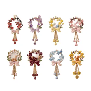 Set of eight colorful enamel floral wreath pendants with animal charms and bows