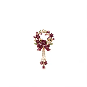 Exquisite vintage December flower wreath pendant with bee and bow tassel charm details