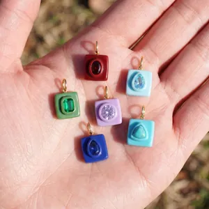 Colorful 18K gold plated stainless steel square pendants set with vibrant mixed gemstones