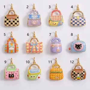 Detailed view of twelve colorful enamel handbag charms featuring diverse plaid and cartoon patterns