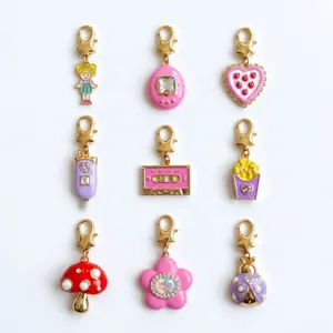 Detailed view of nine colorful enamel charms with 18K gold plating and star clasps