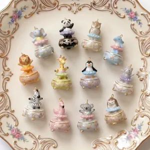 Hand-painted ceramic ballet animal charms featuring cute panda and penguin designs