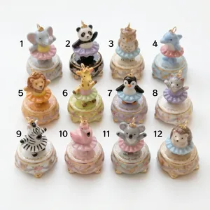 Overview of 12 cute hand-painted animal pendants wearing colorful tutus on white background