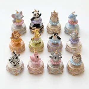 Collection of hand-painted porcelain animal ballet pendants with colorful tutu skirts and crowns