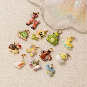 Close-up view of diverse colorful enamel animal charms for DIY stainless steel jewelry