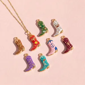 Detailed view of colorful enamel cowboy boot pendants featuring 12 zodiac symbols