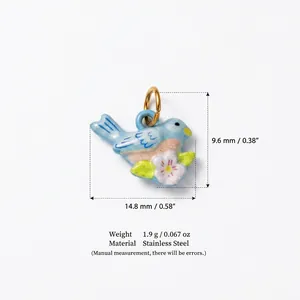 Detail view of a blue bird pendant with dimensions 14.8mm x 9.6mm and weight of 1.9g