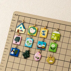 Detailed view of colorful dopamine-style enamel charms with various cartoon designs