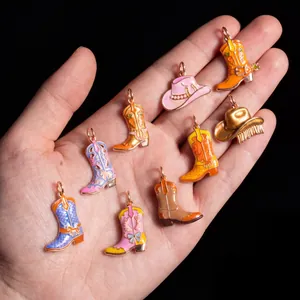 Detailed view of colorful enamel cowboy boot and hat charms for DIY jewelry making