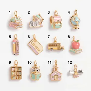 Detail view of 12 different school-themed colorful enamel charms for DIY jewelry making.